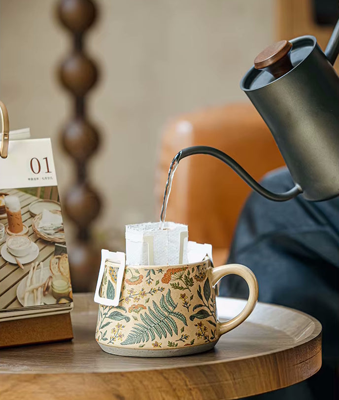 Gooseneck Kettle Making Tea In Fern Pattern Mug Enchanting Botanicals Pottery Cup With Floral And Plant Design